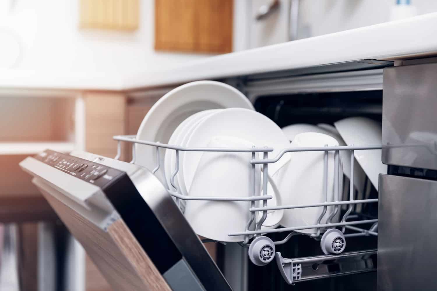 dishwasher close-up with washed dishes, easy to use and save water, eco-friendly, built-in kitchen dish washing machine