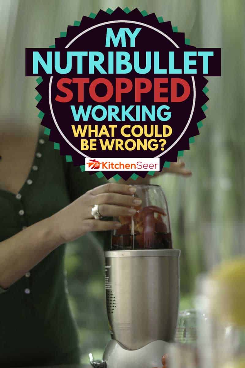 一个年轻的女人做水果奶昔喝使用nutibullet加载后水果,我NutriBullet停止工作——可能是错的呢?