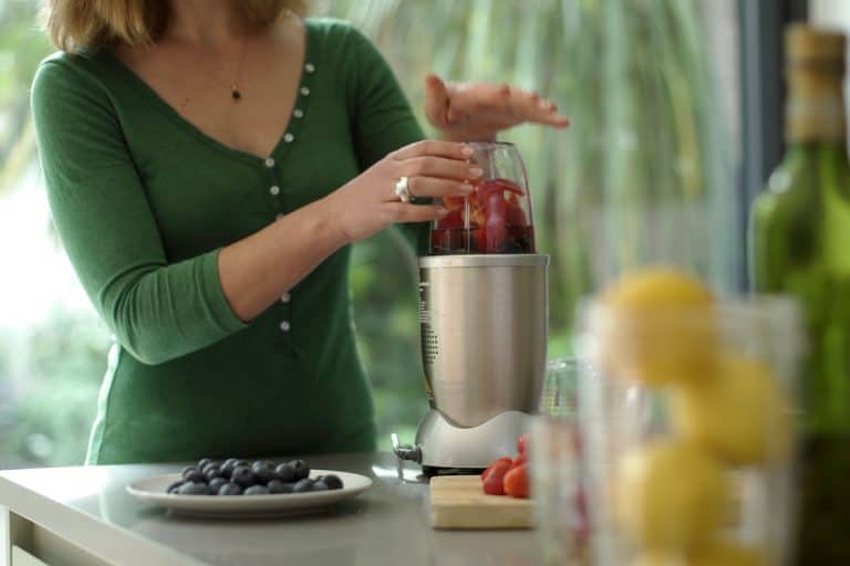 Woman blending many varieties of fruits into her blender, What Can You Use A Nutribullet Blender For?