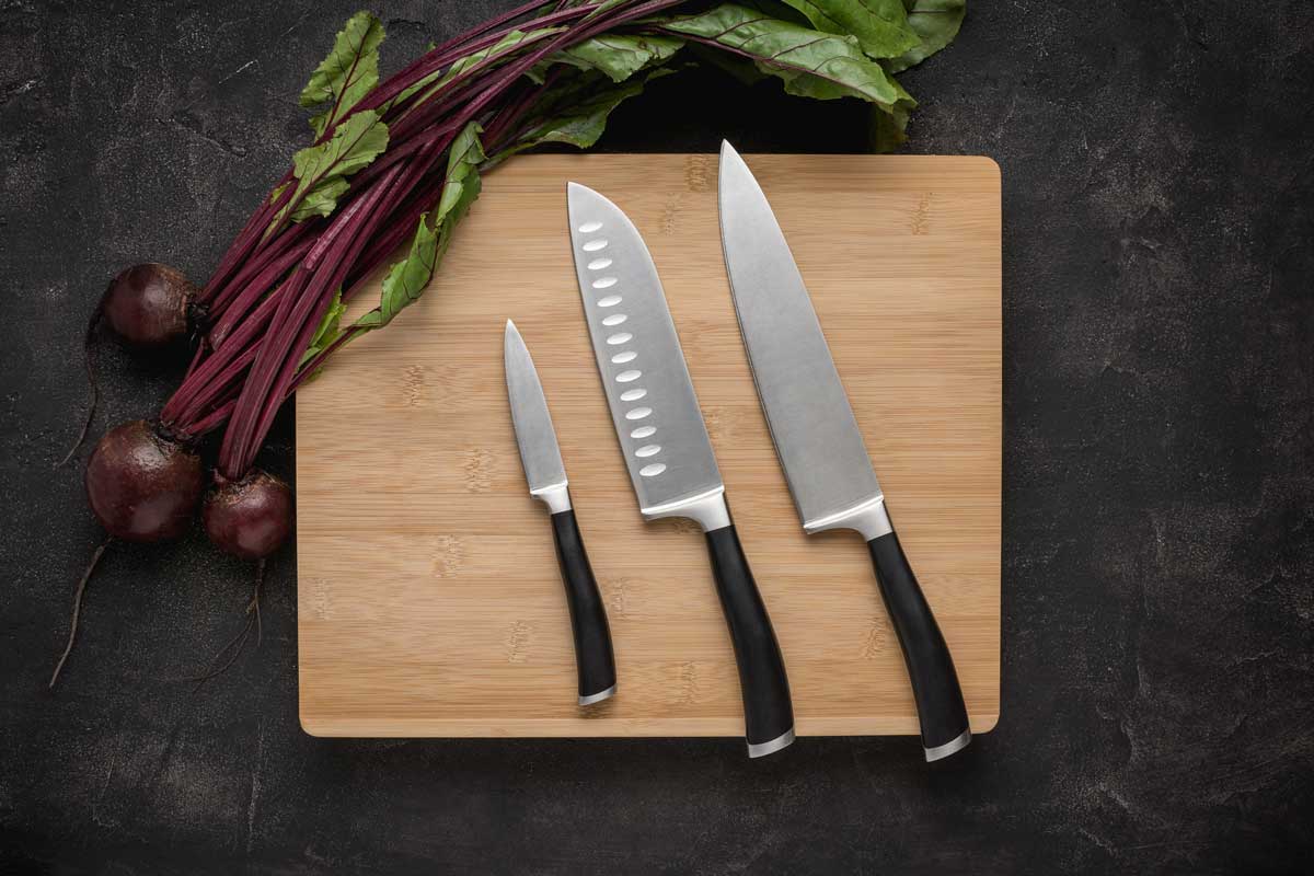 Kitchen Knives Set on Wood Cutting Board, Can You Put Kitchen Knives in the Trash?