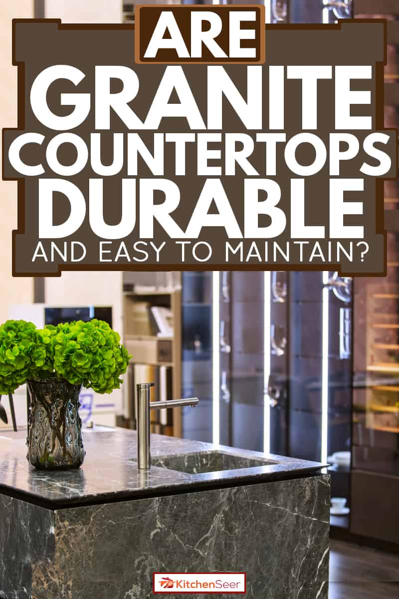 豪华的现代厨房灰色花岗岩台面的室内植物雷电竞官网网址放在一个罐子里,花岗岩台面耐用(且易于维护)?雷竞技官网rb