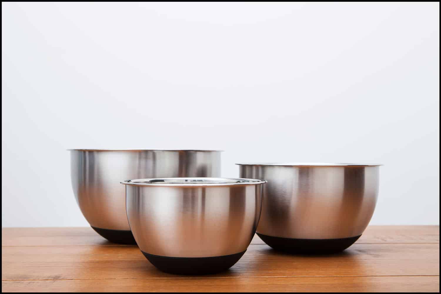 Three different sized silver coloured kitchen mixing bowls, When Should You Not Use Metal Mixing Bowls?