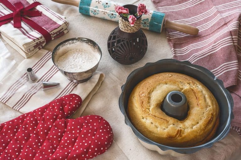 A bundt pan and other baking equipments on the side, How Big Is A Bundt Pan? [How Many Cups It Can Hold]