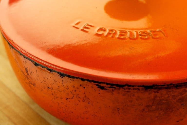 An orange colored Le Creuset cast iron pot, Can A Le Creuset Pot Go In The Oven?