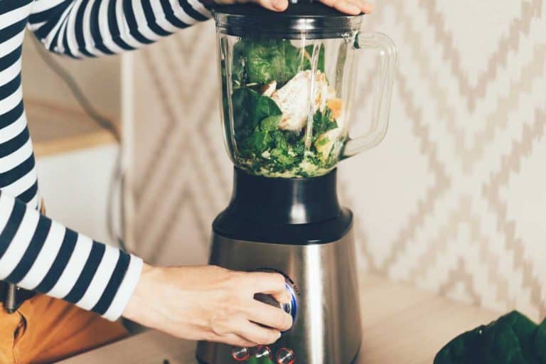 A large blender bowl whips the ingredients for a smoothie, Is A Blender Dishwasher Safe? [Including Top Brands]