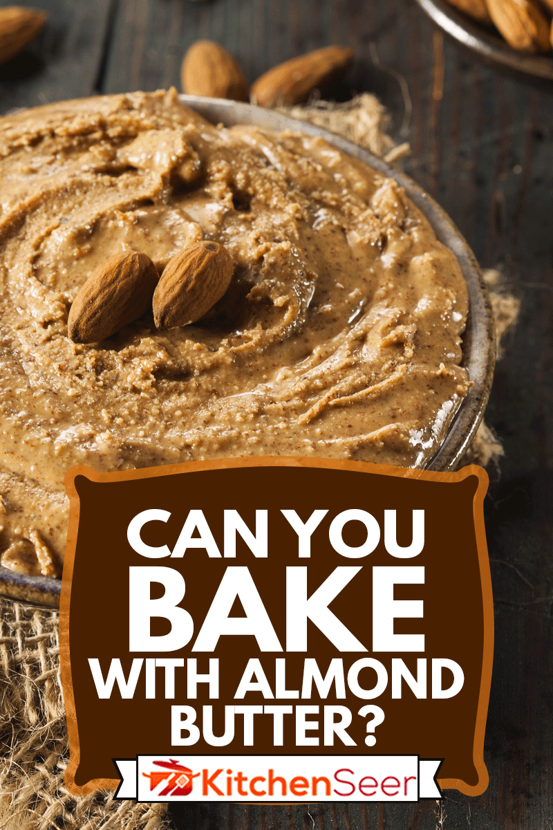 生的有机杏仁黄油的背景，你可以用杏仁黄油烘焙吗?