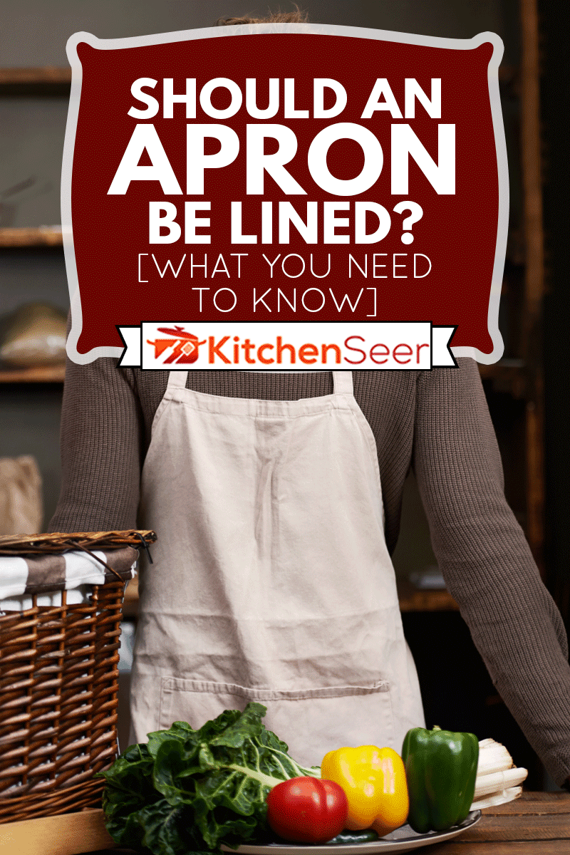 的画像一个英俊的年轻人站在他的食品摊位,一盒成分,围裙应该排吗?【你需要知道的】