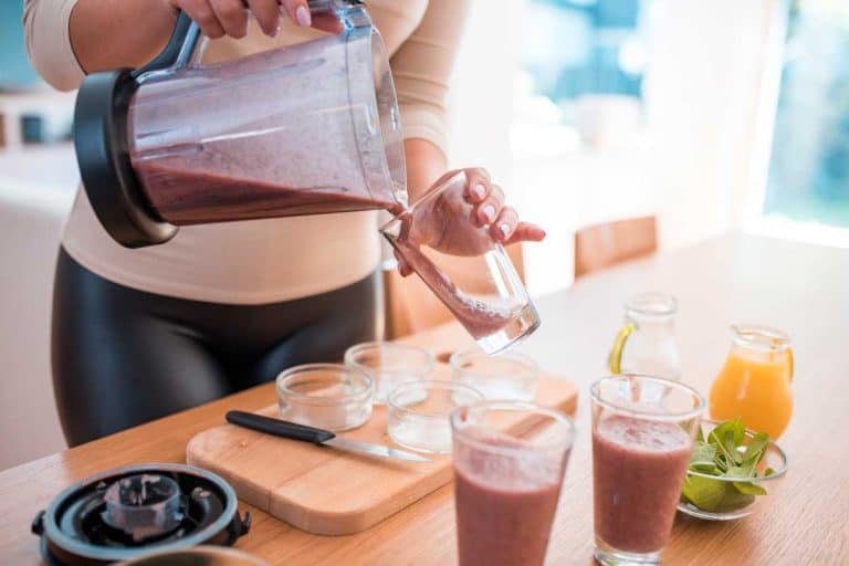 Young woman preparing a smoothie, Is A Blender Good For Making Frozen Drinks?