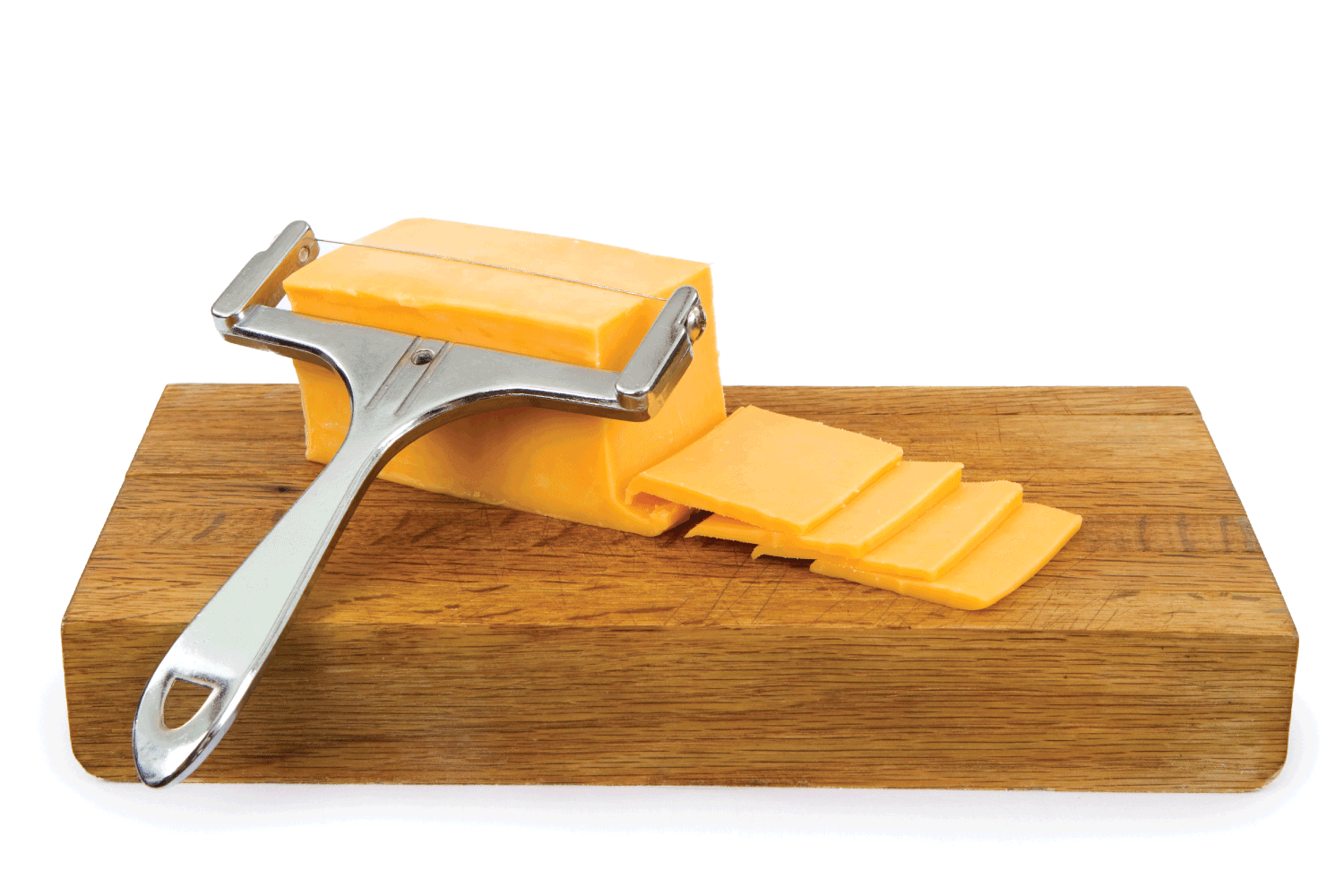 Cheddar Cheese on a Cutting Board with cheese wire cutter