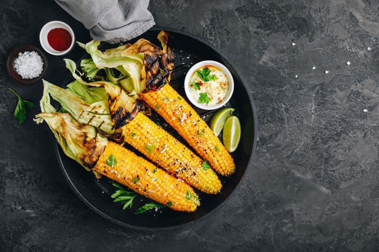 Roasted or grilled sweet corn cobs with garlic butter and lime, Is It Better To Grill Corn With Or Without The Husk?