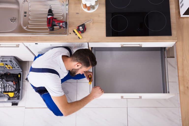 High Angle View Of Male Carpenter Fixing Drawer In Kitchen, Can You Buy Replacement Kitchen Drawers?