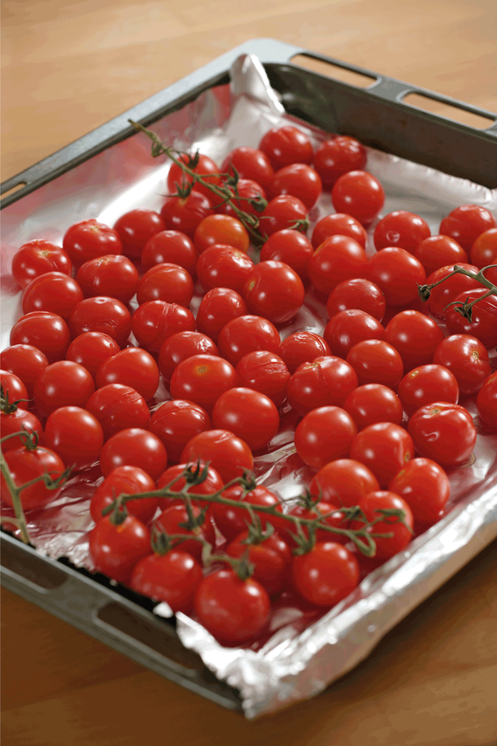 Roasted cherry tomatoes in a baking pan