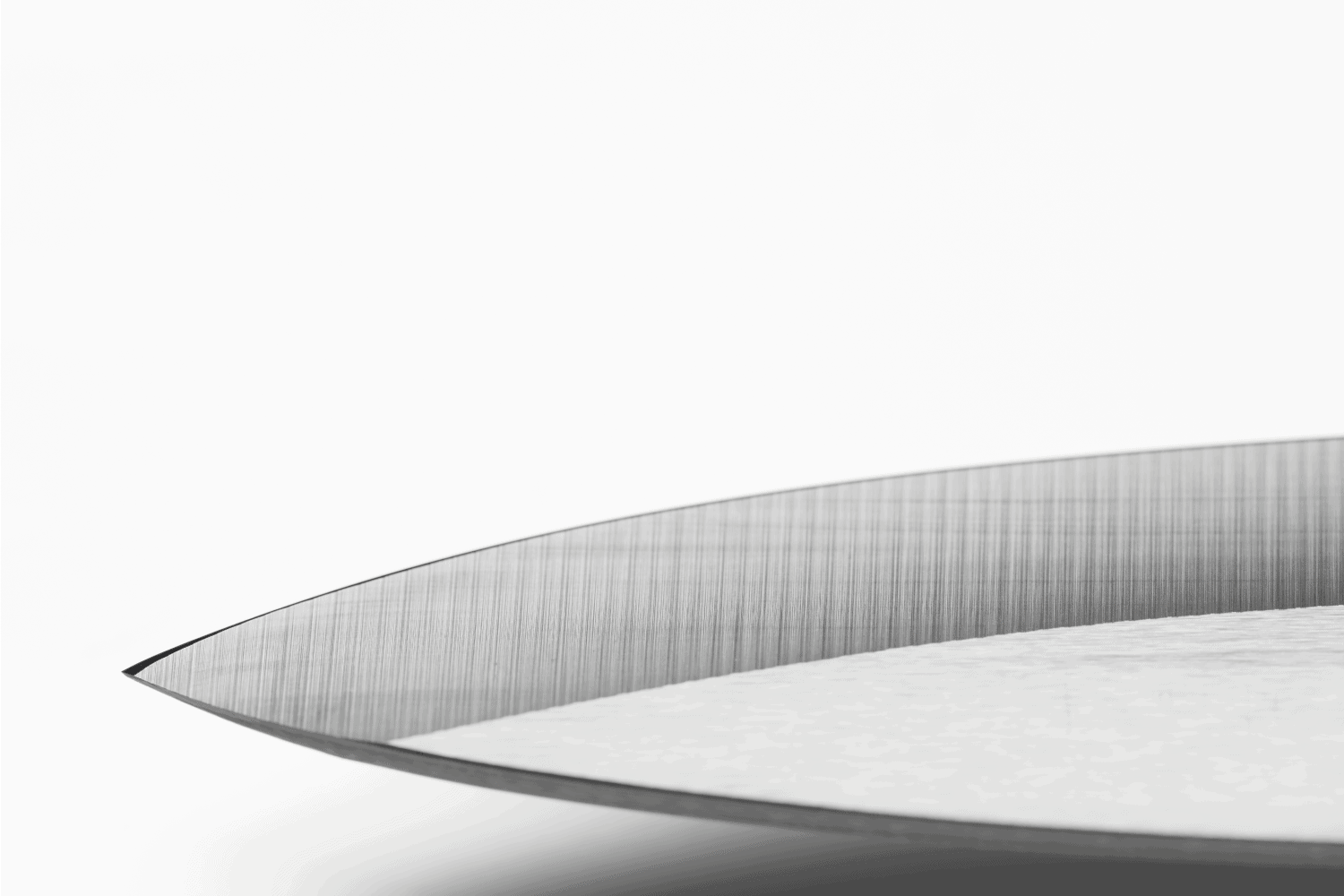 Knife-edge of sharpened professional ceramic chef's knife.