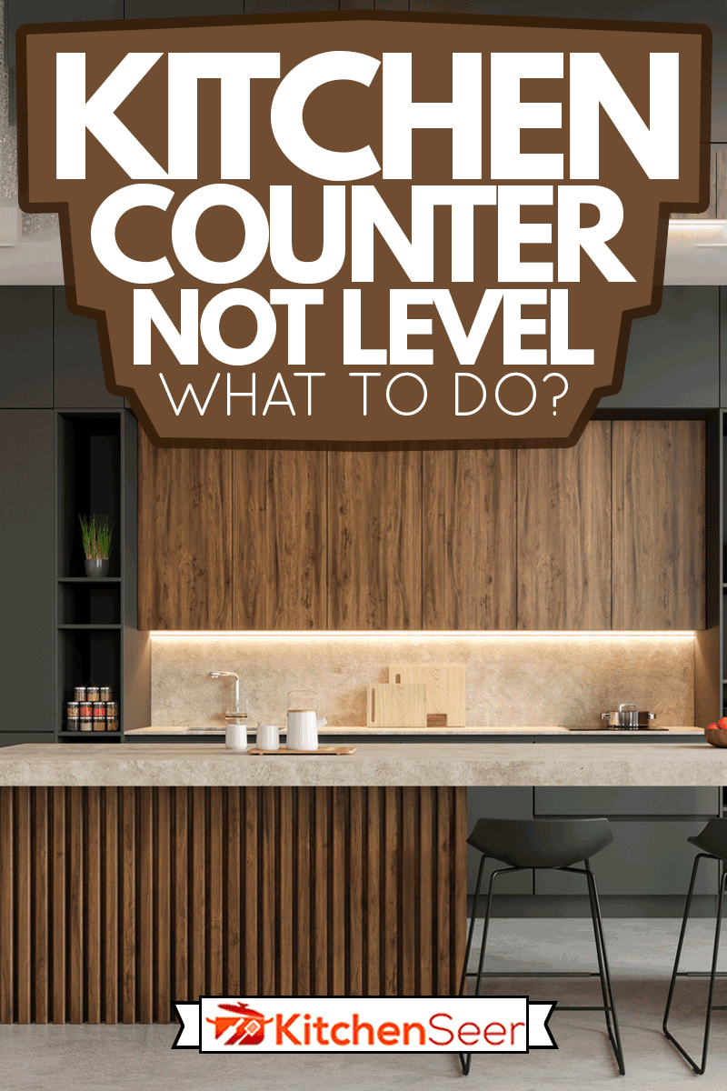 大型现代开放空间阁楼厨房内部，设有大型厨房岛和酒吧椅，厨房雷电竞官网网址柜台不水平-该怎么办?