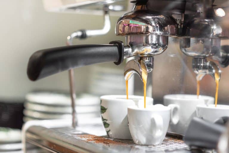 An espresso machine pouring two cups of coffee at the coffee shop, Should You Turn Off An Espresso Machine?