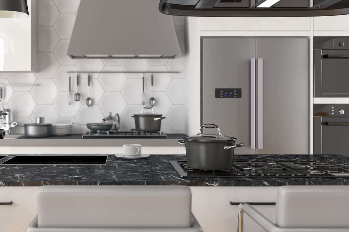 当代的启发与现代厨房电器和一个黑色的花岗岩台雷电竞官网网址面