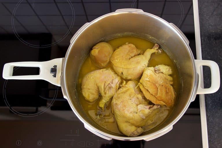 traditional Greek food of chicken stew with onion and lemon juice, cooked in a pressure cooker at home ready to eat, How Long To Cook Chicken In A Pressure Cooker?