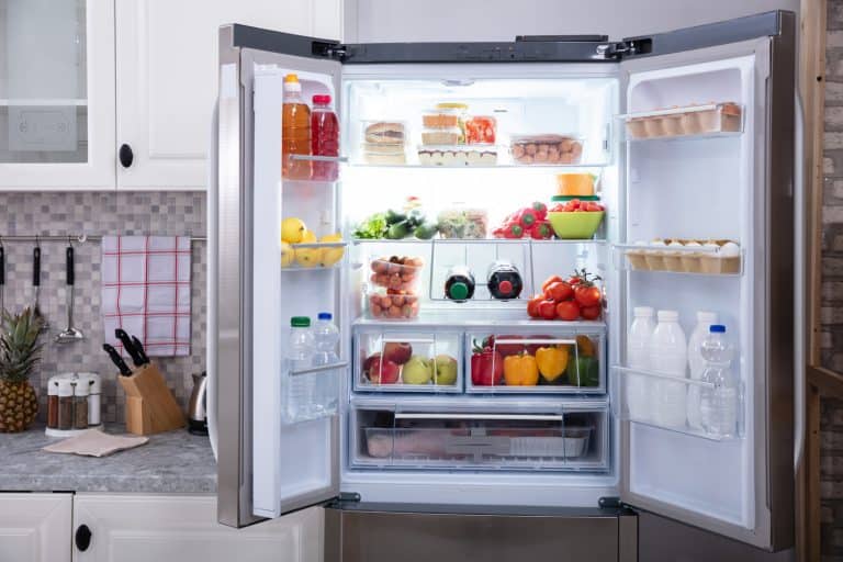 An Open Refrigerator Filled With Fresh Fruits And Vegetables - How Long Should Refrigerators Sit After Moving
