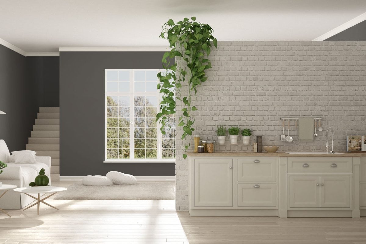 干墙砖连壁与白色的厨柜在一个现代的客厅雷电竞官网网址