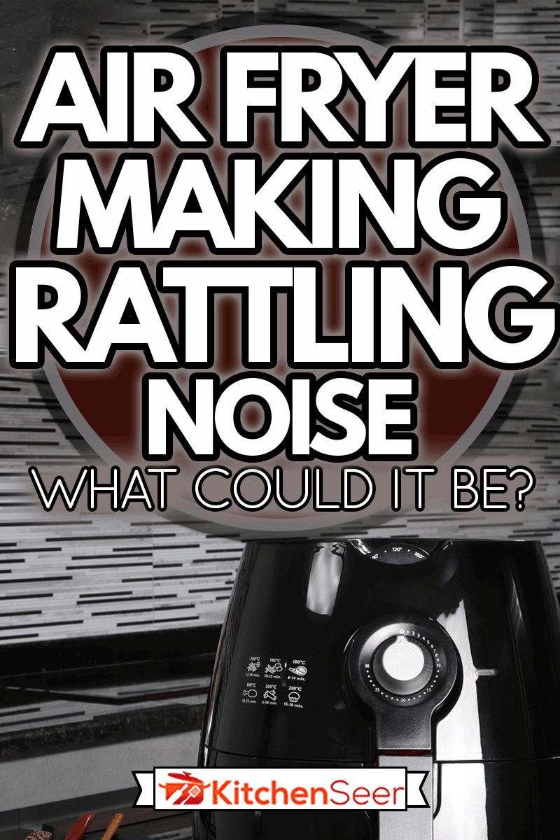 黑油炸锅或无油炸锅,空气炸锅设备,和一碟炒黑椒肉和猪肉是黑色大理石桌上的漂亮的厨房,空气炸锅使冲击声——可能是什么病呢?雷电竞官网网址