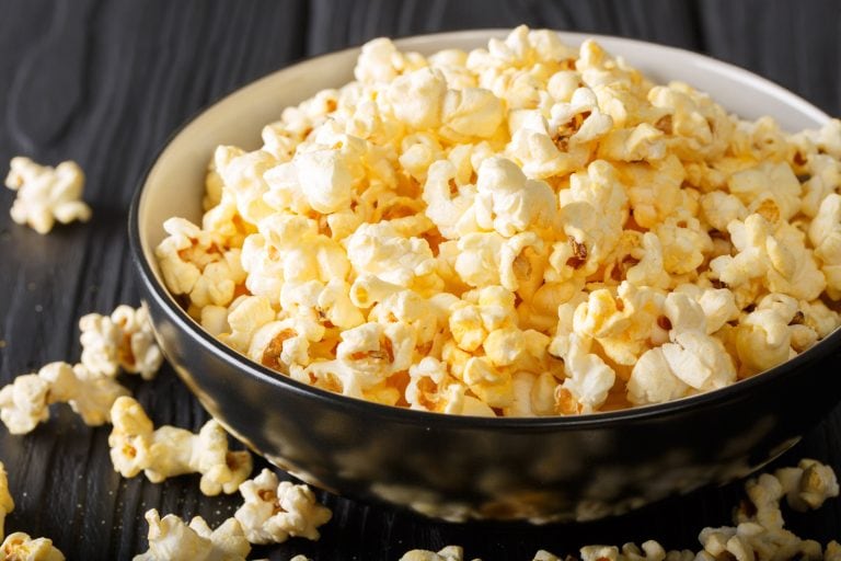 salted popcorn with cheddar cheese and parmesan in a bowl - How Long To Microwave Popcorn