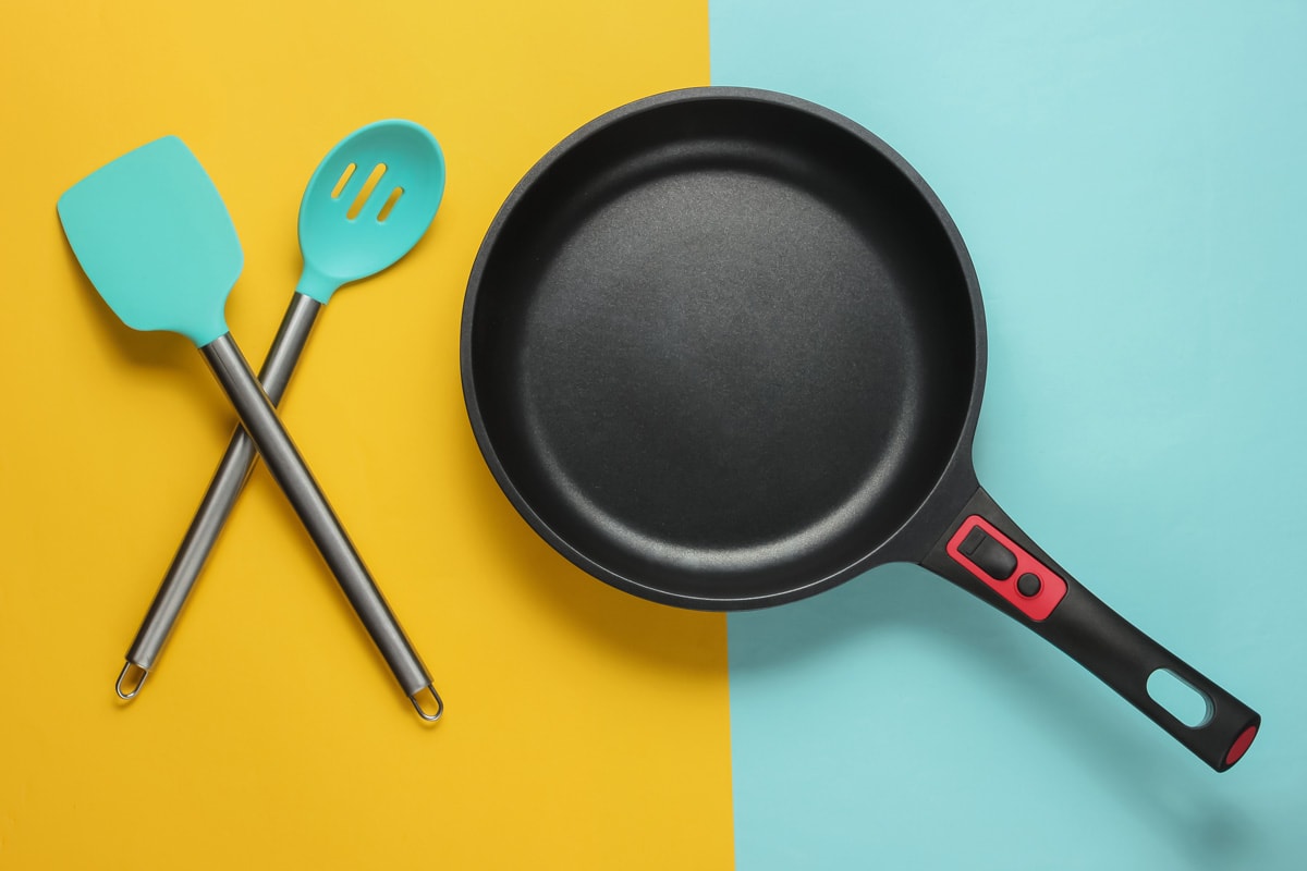 A silicone spatula and non-stick skillet