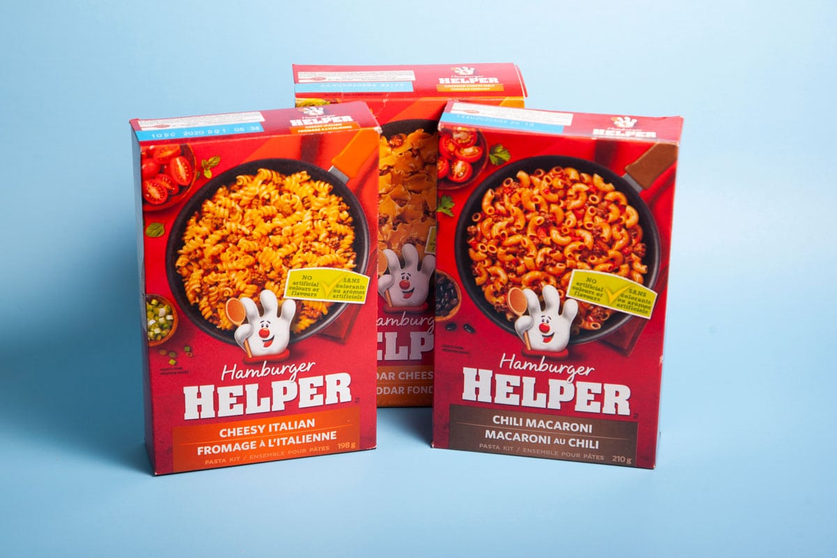 3 boxes of hamburger helper on a light blue background