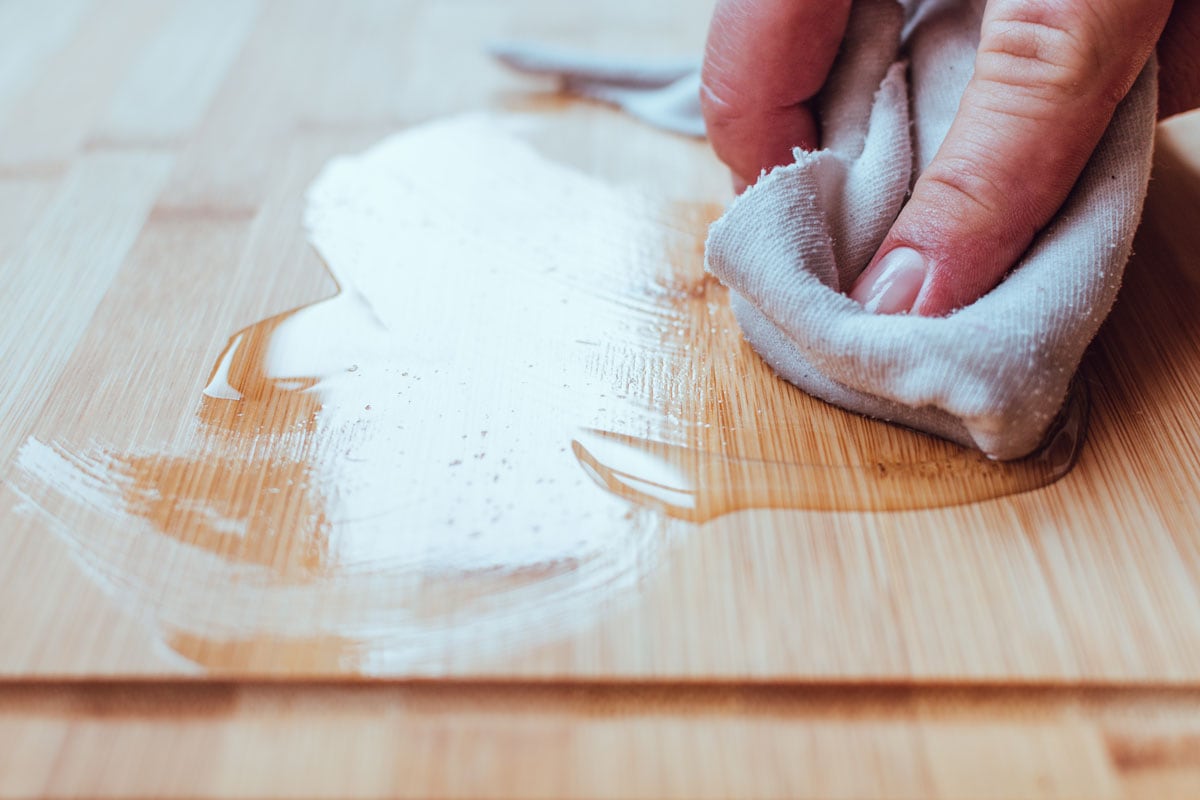 Applying wood care oil on a food cutting board